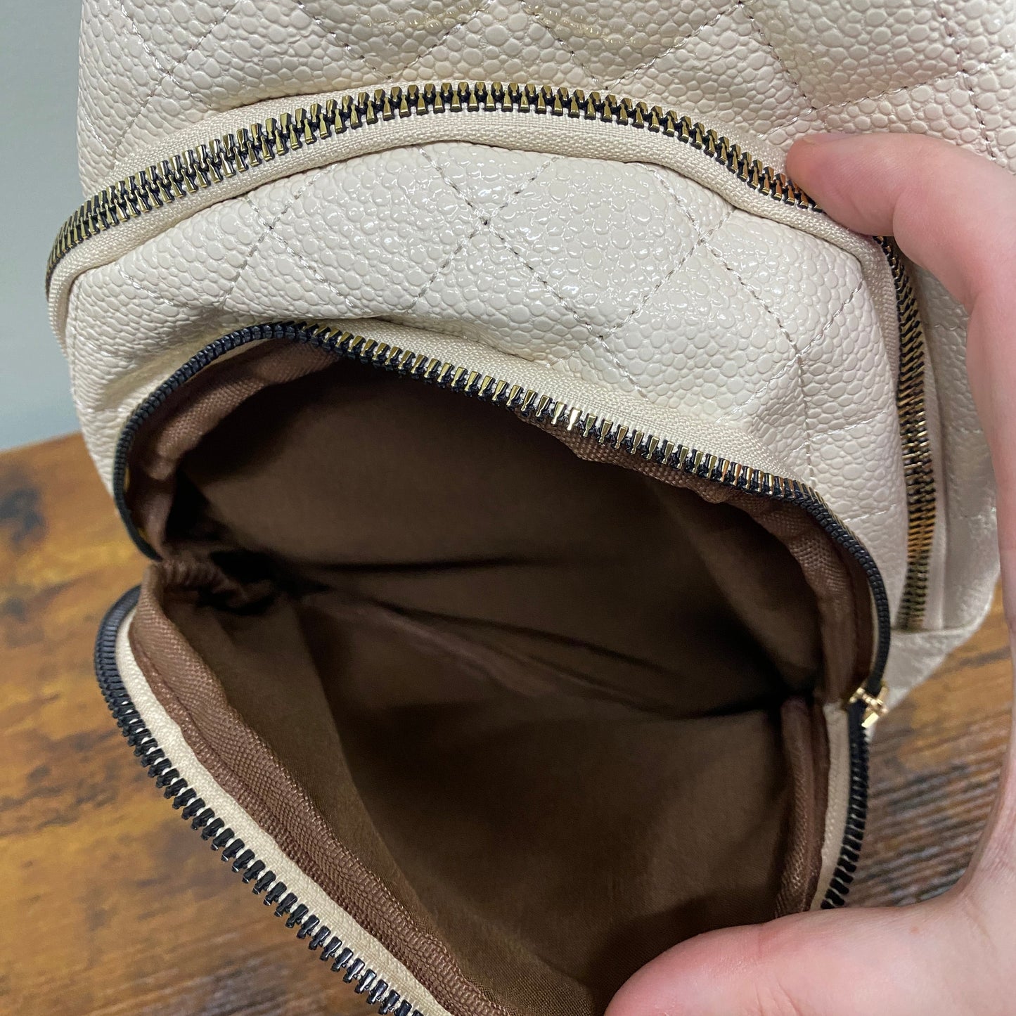 The Faux Leather Quilted Sling Crossbody - Cream