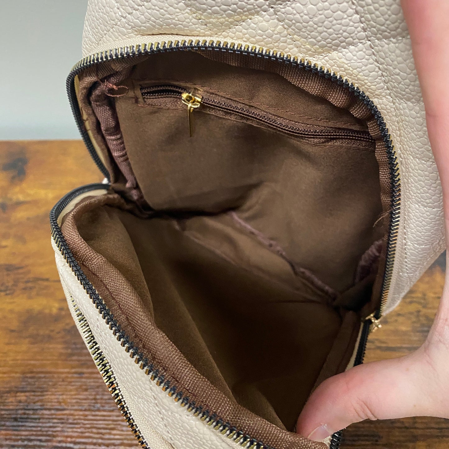The Faux Leather Quilted Sling Crossbody - Cream
