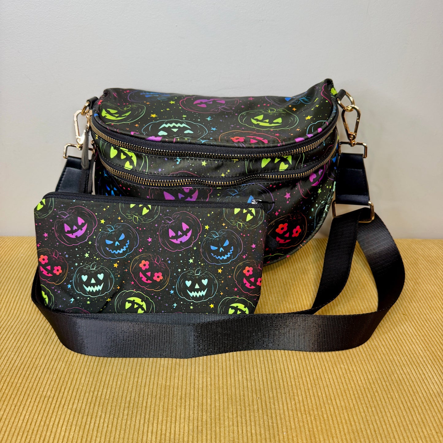 Limited edition Halloween Jack-O'-Lantern Roni Crossbody Bag with coordinating water-resistant pouch. Only 4 matching sets available. Ready to ship.