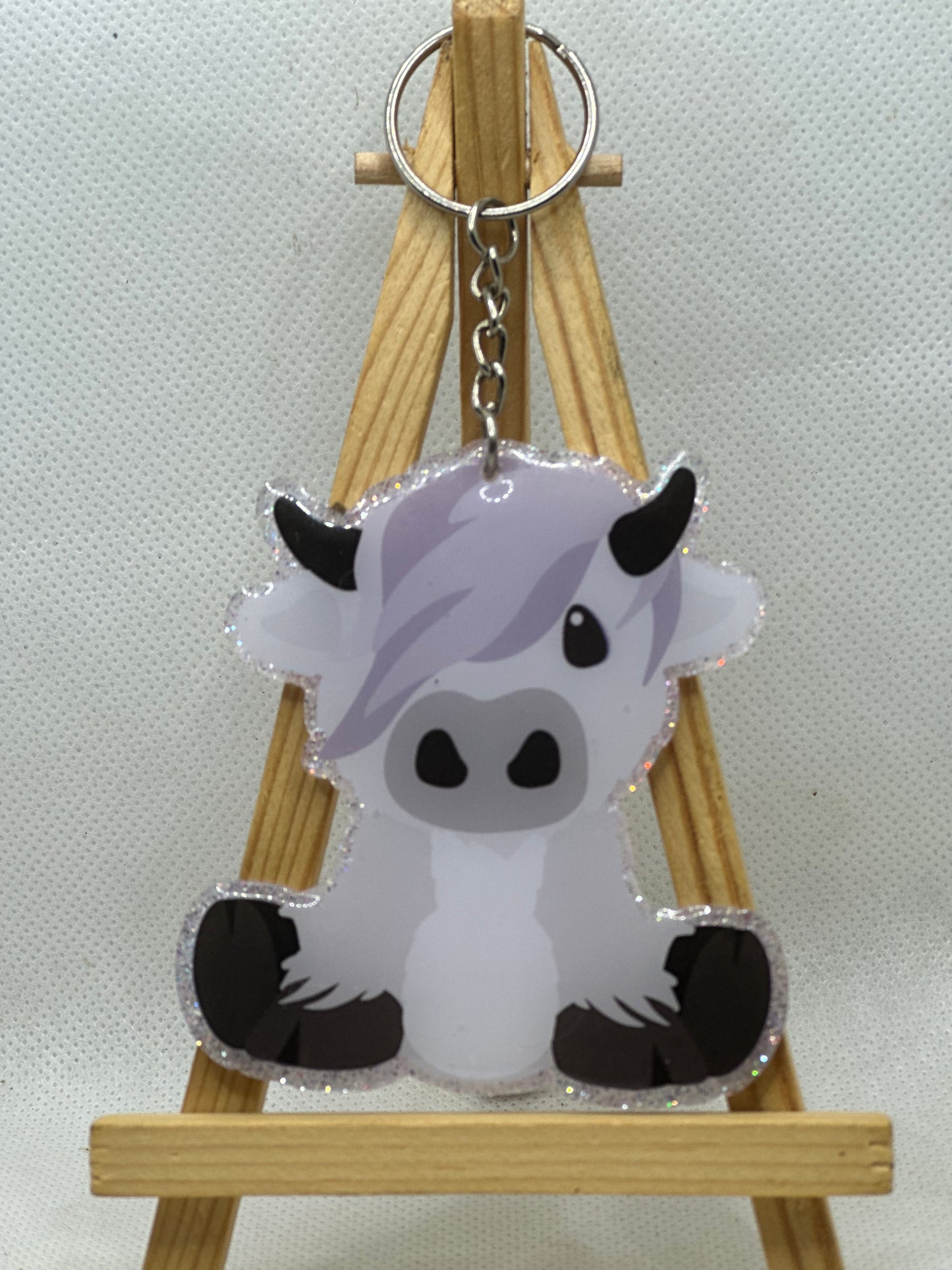 3" Gray/White Sitting Scottish Highland Cow