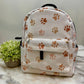 Paw Prints on Tan - Water-Resistant Mini Backpack