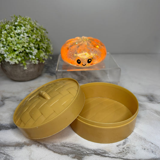 Squeeze, squish, and smile! These viral slow rise dumpling squishy toys feature adorable faces, glitter finishes, and include a bamboo-style storage steamer. Perfect for fidgeting, stress relief, gifts, and collecting.
